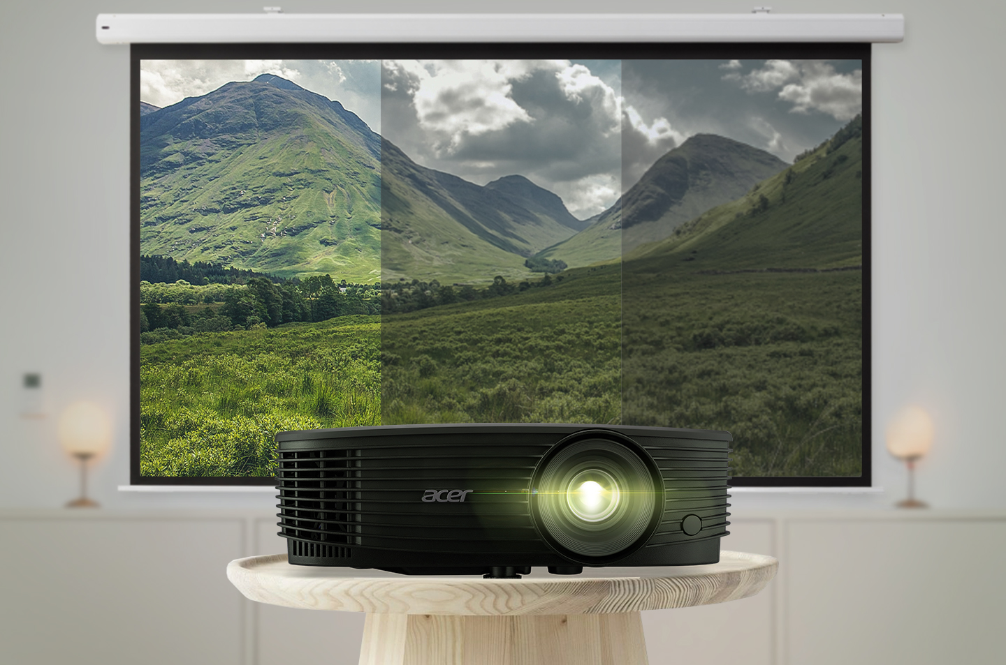  A black Acer projector sits on a table in a home theater displaying a large image of mountains on a projection screen.